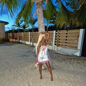 White dress with star deign & seashell bra top